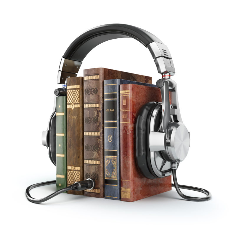 Vintage books with headphones plugged into them